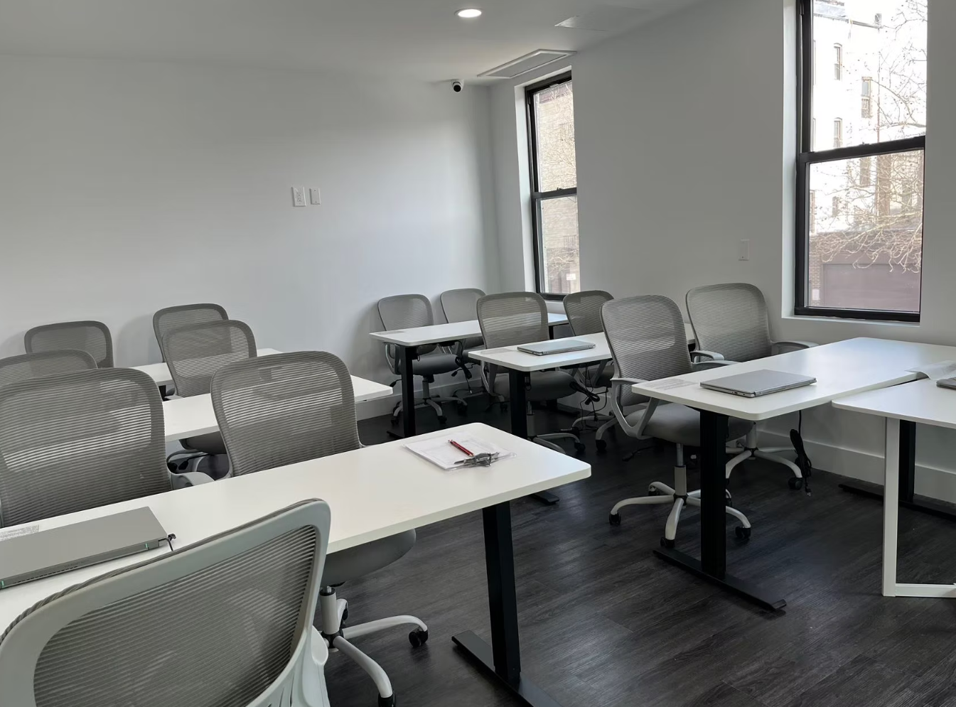 Bright ToIvy classroom with natural light, ergonomic mesh chairs, and modern desks