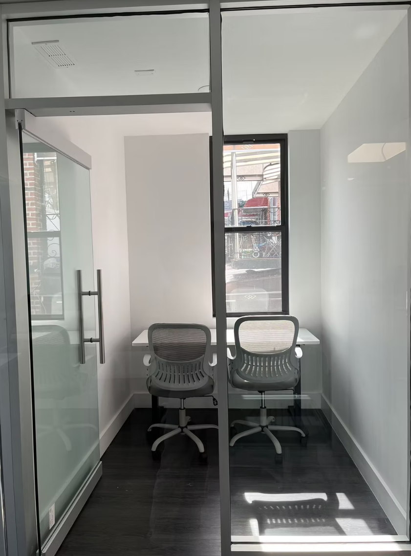 Private ToIvy study booth with two ergonomic chairs facing a window for focused tutoring