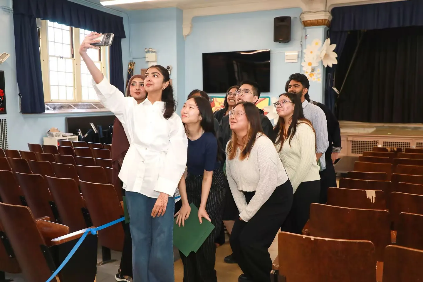Students, mentors, and families before the ceremony: the community that made it possible